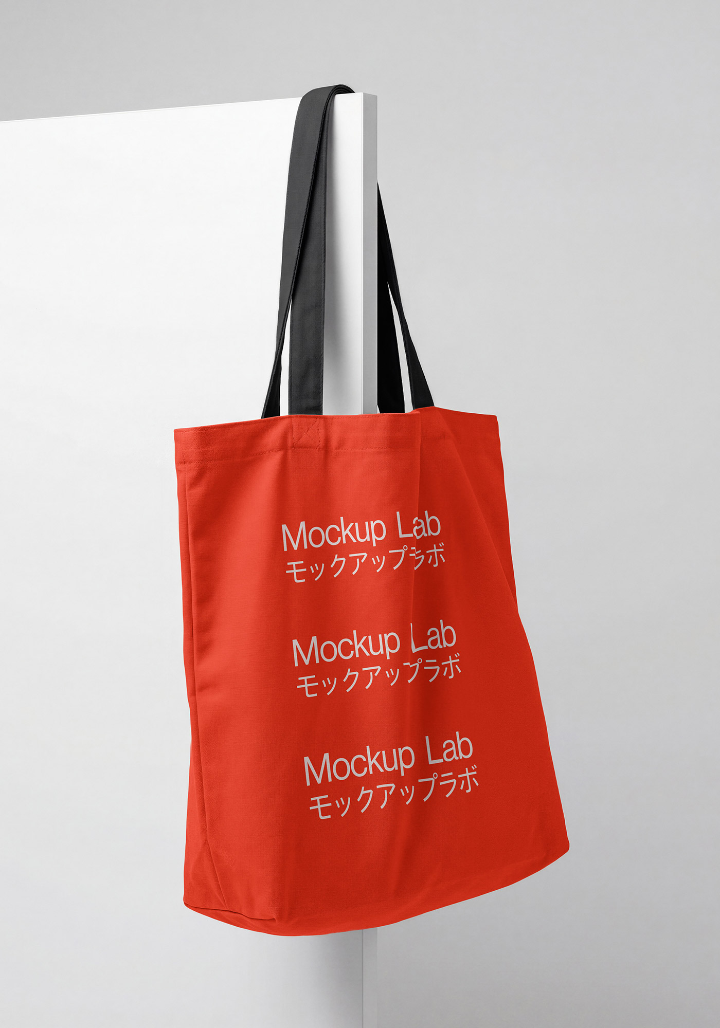 Front view of a white tote bag mockup with customizable design area.